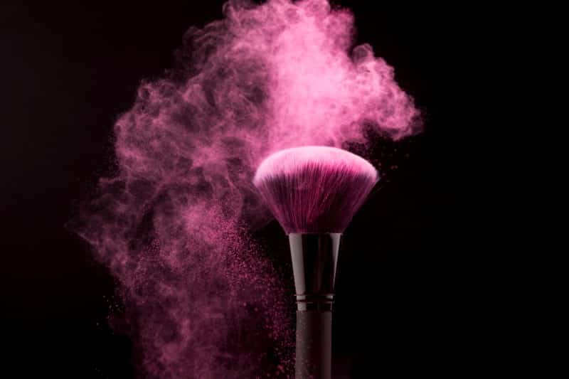 cosmetic brush cloud pink powder dark background 1.jpg