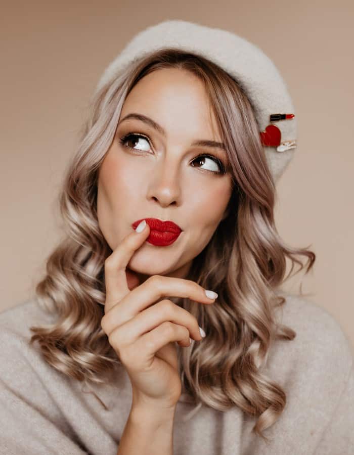 curious well dressed woman thinking about something with smile 1.jpg
