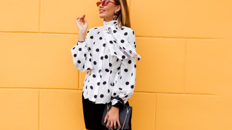 graceful woman stylish casual outfit posing with black leather luxury bag 1.jpg
